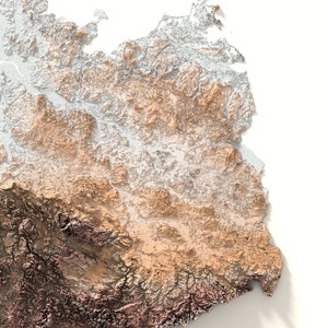 May include: A detailed topographic map of a mountainous region. The map uses a color gradient to show elevation, with brown representing lower elevations and white representing higher elevations.
