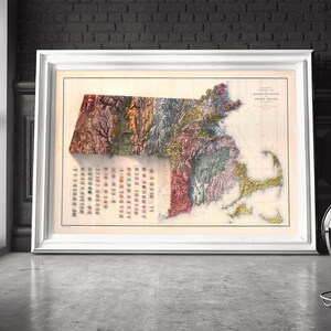 May include: A vintage map of Massachusetts, showing the state's topography and geological features. The map is printed in a variety of colors, including green, brown, and yellow. The map is framed in a white frame.