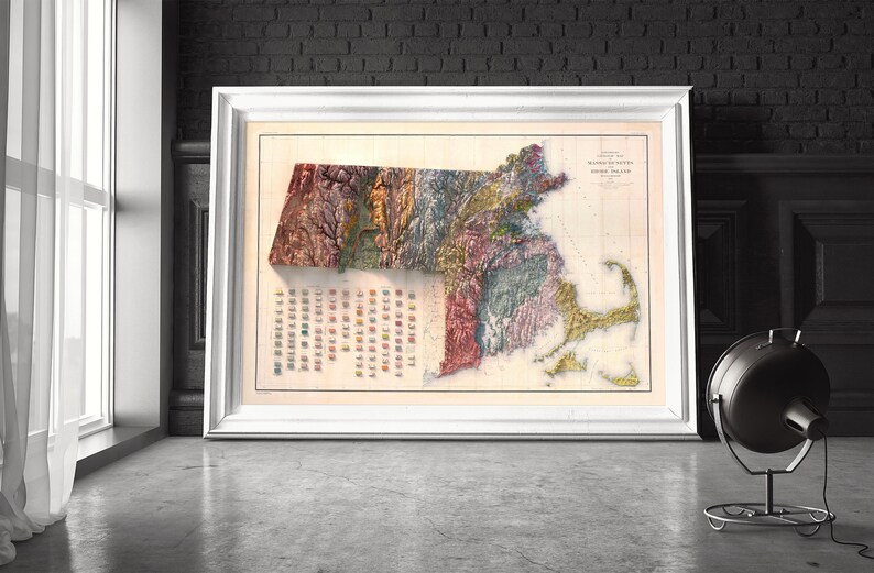 May include: A vintage map of Massachusetts, showing the state's topography and geological features. The map is printed in a variety of colors, including green, brown, and yellow. The map is framed in a white frame.