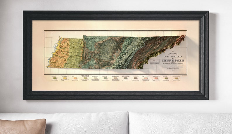 May include: A vintage, framed, relief map of Tennessee. The map is in shades of green, brown, and yellow, and shows the state's geological features. The title "A Preliminary Geological Map of Tennessee" is printed in the lower right corner.