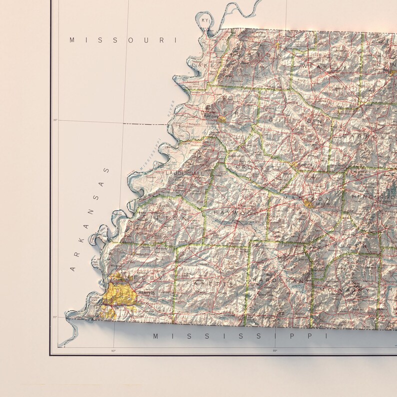May include: A vintage-style topographic map of the state of Arkansas. The map shows the state's borders, major cities, and rivers. The map is printed in shades of brown, green, and blue.