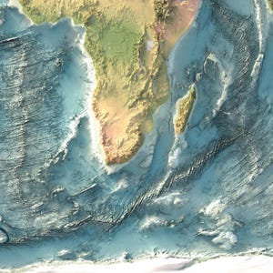 May include: A topographic map showing the southern tip of Africa and the island of Madagascar, featuring detailed relief shading of the landmasses and the complex, textured bathymetry of the surrounding Indian and Atlantic Ocean seafloor.
