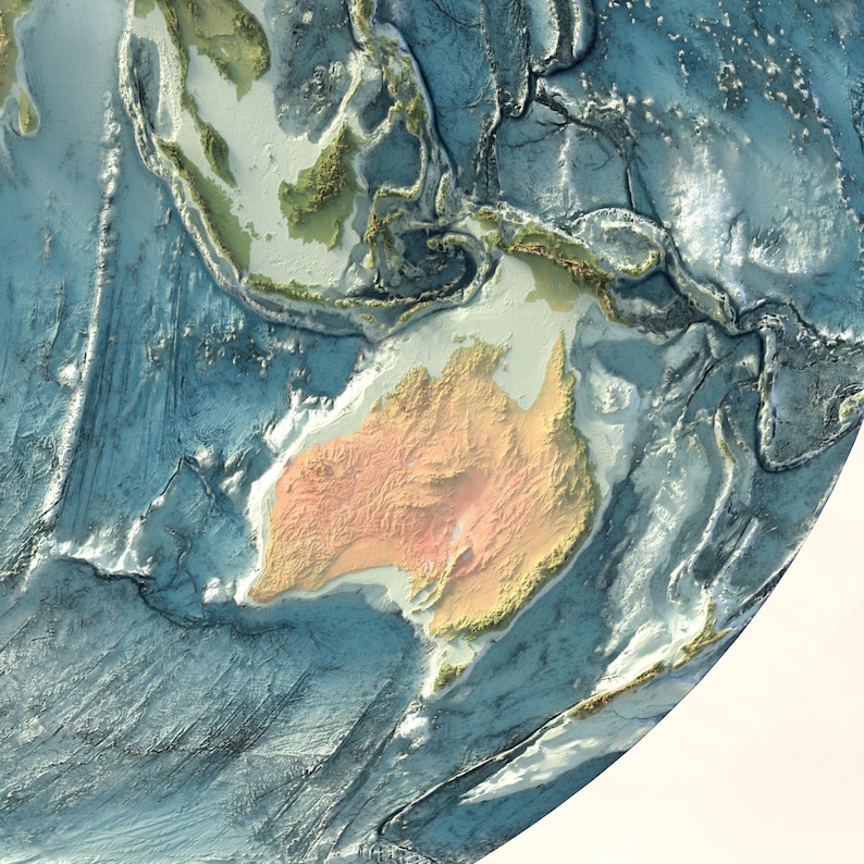May include: A physical relief map of the Earth featuring a textured, three-dimensional representation of the Australian continent in shades of tan and orange, surrounded by deep blue ocean basins with visible underwater topography and ridges.