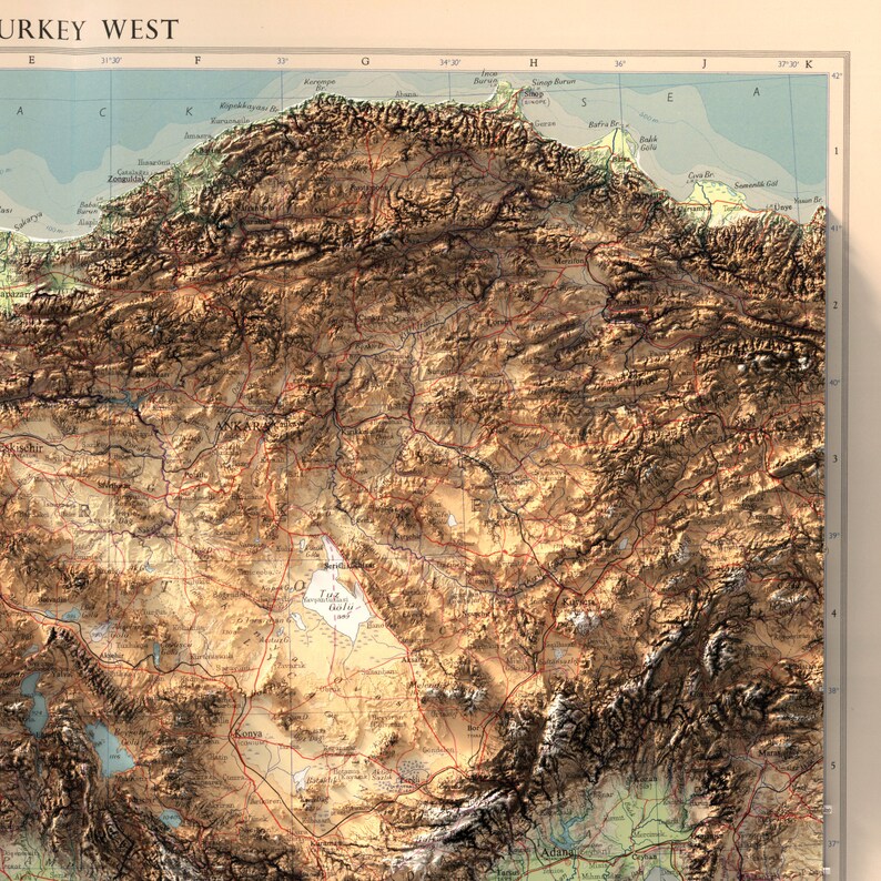 May include: A detailed topographic map of western Turkey, showing the country's diverse landscape, including mountains, valleys, and rivers. The map is printed in brown, green, and blue tones, with labels for major cities and geographic features.