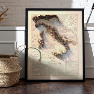 May include: A vintage-style map of Italy with a 3D textured design. The map is framed in black and has a white background with brown text and details. The map shows the outline of Italy with the islands of Sicily and Sardinia.
