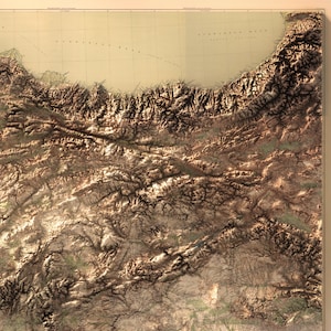 May include: A detailed topographic map of a mountainous region, showing elevation changes and river systems. The map is printed on a cream-colored paper with brown lines and text.