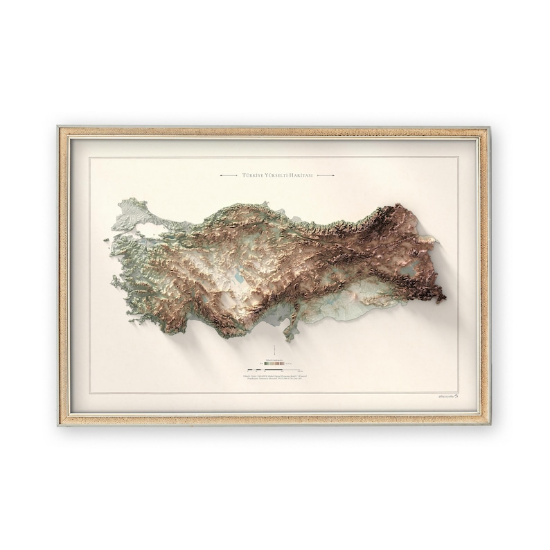 May include: A framed map of Turkey with a 3D relief showing the country's topography. The map is printed on a cream-colored background with a brown frame. The title "T&uuml;rkiye Y&uuml;kseklik Haritası" is printed at the top of the map.