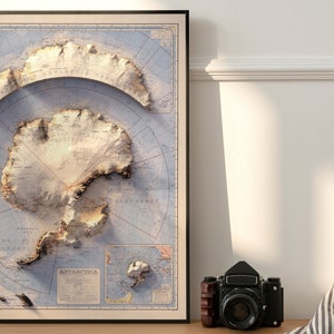 May include: A vintage-style map of Antarctica with a 3D effect, showing the continent's topography and surrounding seas. The map is printed on a light blue background with brown and white details. The title "ANTARCTICA" is printed in the lower right corner.