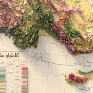 May include: A vintage map of the Mediterranean Sea with a detailed colour-coded key showing different geological formations. The map is titled "Atlas of Geological Formations" in Arabic. The map shows the island of Cyprus in the bottom right corner.