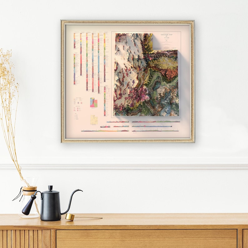 May include: A framed vintage-style geological map of the Grand Canyon, featuring a 3D relief map and a color-coded key showing different rock formations.