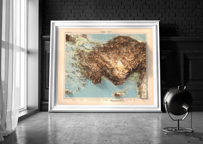 May include: A framed vintage map of Turkey with a 3D relief effect, showing the country's topography with brown and green hues. The map is titled "TURKEY WEST" and is surrounded by a white frame.