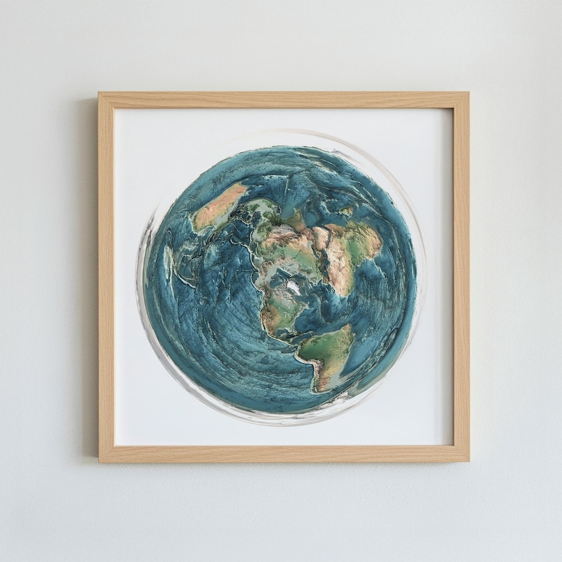 May include: A framed artwork featuring a detailed, textured depiction of Earth. The artwork showcases continents in shades of brown and green, surrounded by blue oceans. The piece is encased in a light-colored wooden frame, suitable for home decor.