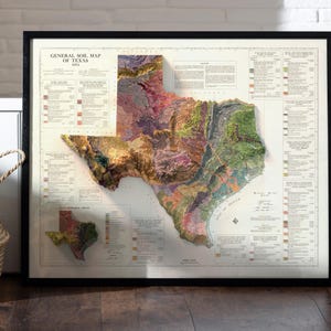 May include: A vintage framed map of Texas showing the general soil map of the state. The map is in a black frame and has a white background with a detailed illustration of the state's soil types. The map is titled "General Soil Map of Texas 1912".