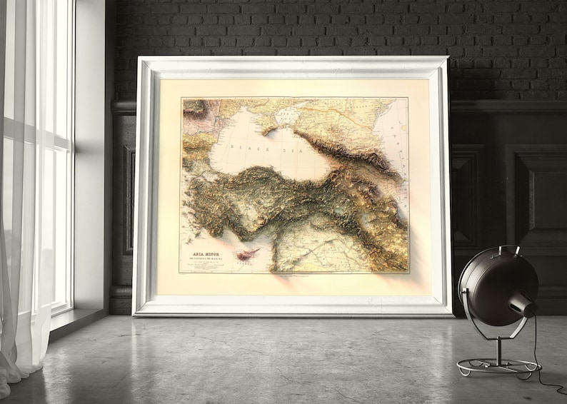 May include: A vintage map of Asia Minor, showing the Black Sea and surrounding terrain. The map is printed in brown, green, and yellow tones and features detailed topography.