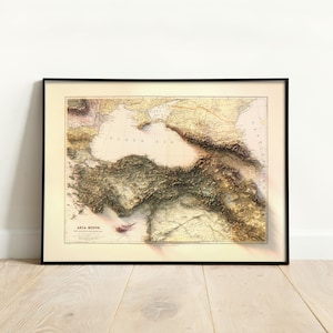 May include: A vintage map of Asia Minor, showing the topography of the region with detailed shading and lines. The map is framed in black and has the title "Asia Minor" at the bottom.