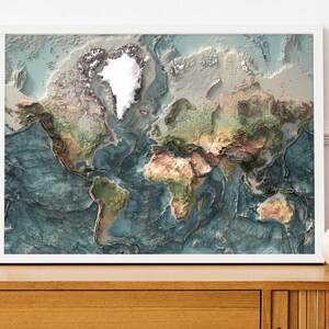 May include: A framed world map with a 3D effect, showing the continents in shades of green, brown, and blue. The oceans are a deep blue, and the map is framed in white.