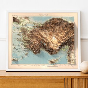 May include: A vintage-style relief map of Turkey West, showing the topography of the region in brown and green hues. The map is framed in white and has the title "TURKEY WEST" at the top.