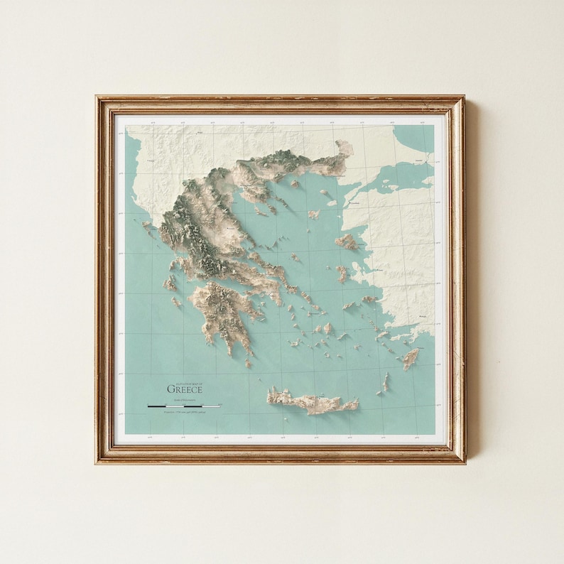 May include: A framed topographic map of Greece featuring a light teal ocean background and cream-colored landmasses with detailed 3D-style relief shading. The map includes a grid overlay, a scale bar, and the text "TOPOGRAPHY OF GREECE".