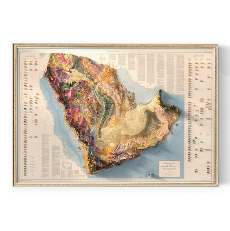 May include: A vintage-style, three-dimensional relief map of the Arabian Peninsula. The map is framed in a light wood frame and features a detailed colour-coded key for different geological formations. The title "Geological Map of the Arabian Peninsula" is printed at the bottom of the map.