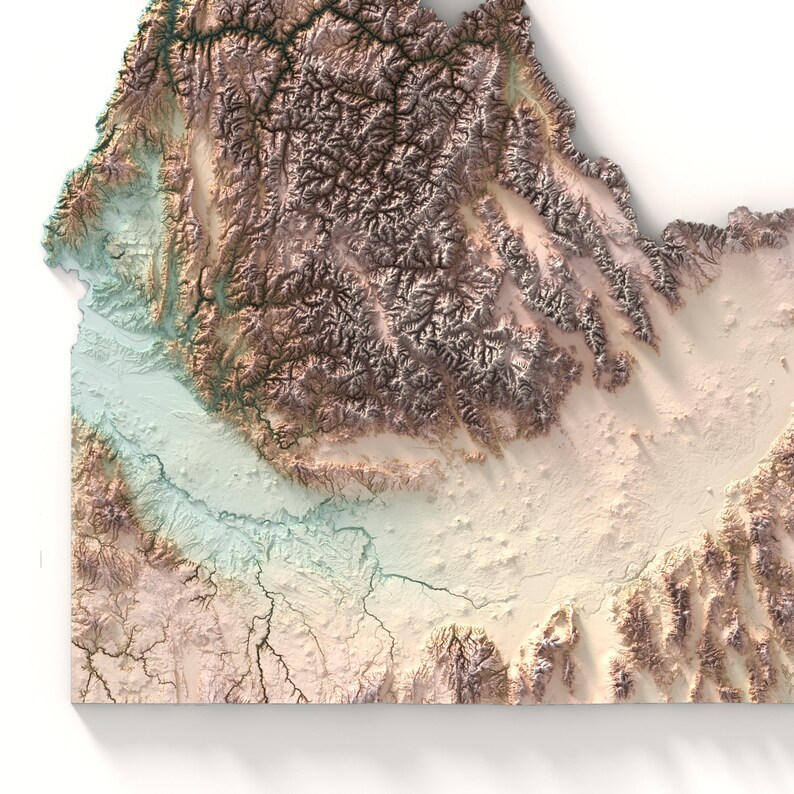 May include: A topographic map of a mountainous region with a river valley running through it. The map is in shades of brown, green, and blue, with a white background.