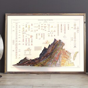 May include: A vintage-style geological map of Virginia, framed in a light wood frame. The map shows the state's geological formations in a colorful, detailed illustration.