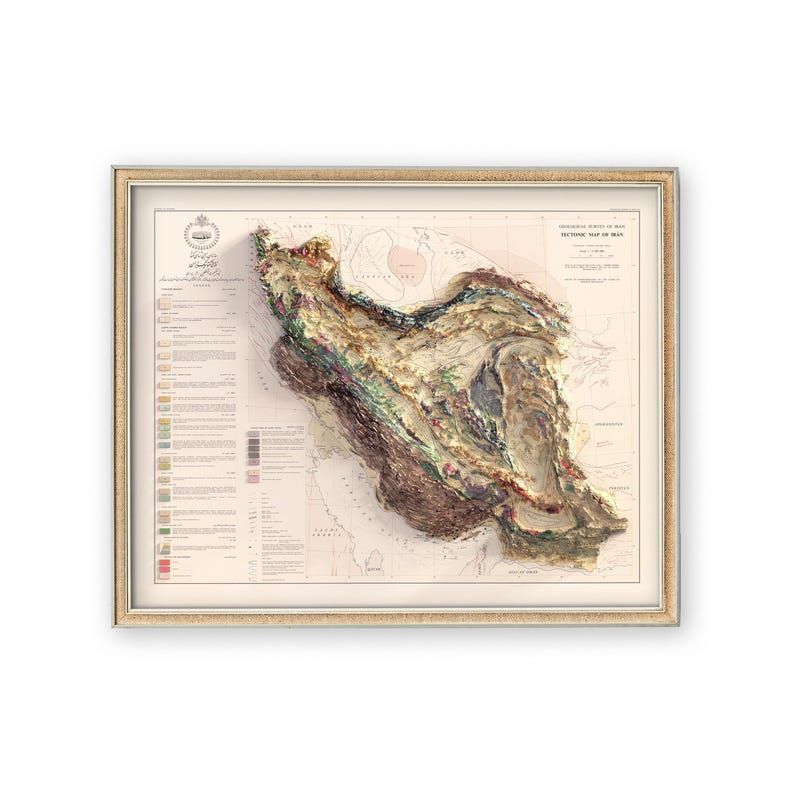 May include: A vintage, detailed, topographic map of Iran, with a 3D effect, showing the country's terrain and elevation. The map is framed in a light wood frame.