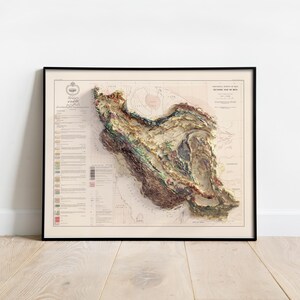 May include: A vintage, detailed, relief map of Iran, printed in shades of brown, green, and beige. The map is framed in black and has a white background. The title "PHYSIOGRAPHIC MAP OF IRAN" is printed at the top of the map.