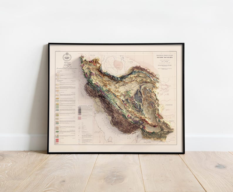 May include: A vintage, detailed, relief map of Iran, printed in shades of brown, green, and beige. The map is framed in black and has a white background. The title "PHYSIOGRAPHIC MAP OF IRAN" is printed at the top of the map.