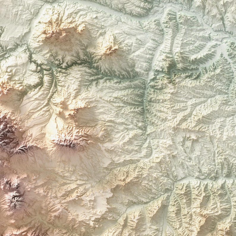 May include: A detailed, textured topographic map with a color palette of beige, brown, and green. The map depicts a mountainous region with valleys and ridges, showcasing the elevation changes. The overall effect is a 3D-like representation of the terrain.