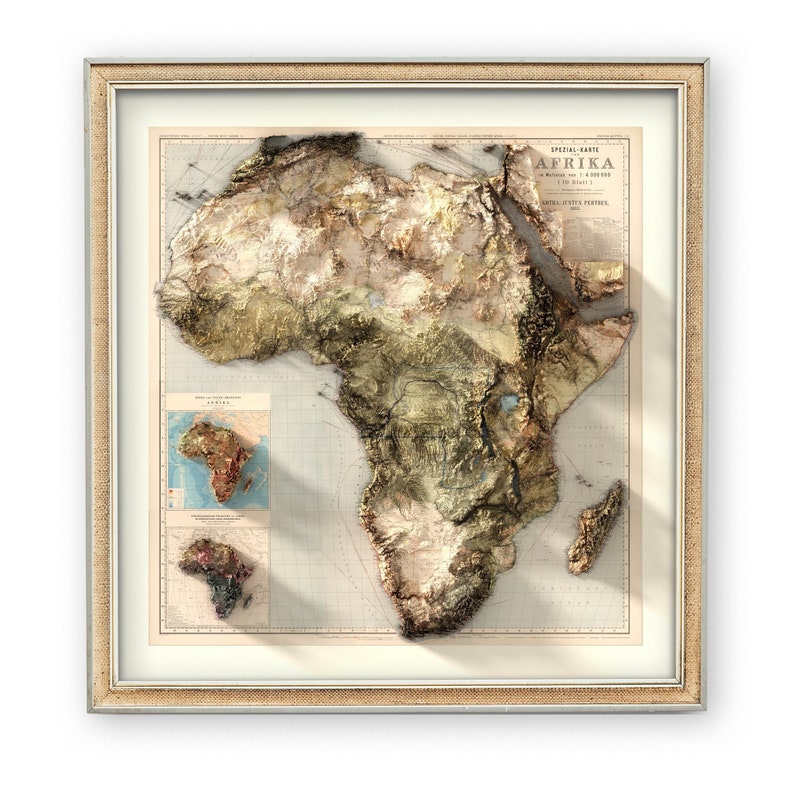 May include: A framed vintage map of Africa with a 3D embossed effect. The map is in shades of brown, green, and blue, with a grid pattern overlay. The title "AFRIKA" is printed in the upper right corner.