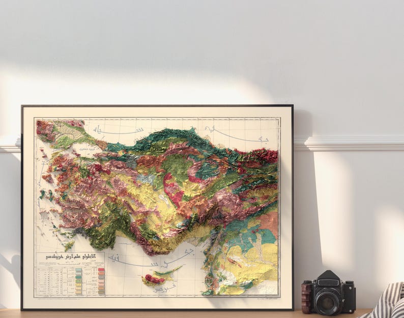 May include: A vintage relief map of Turkey, showing the country's topography with different colours representing elevation. The map is framed and has a title in Turkish.