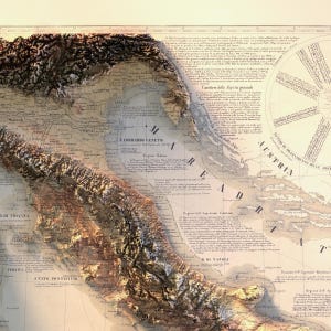 May include: An antique map of Italy, showing the regions of Lombardy, Veneto, and the Kingdom of Naples. The map is printed on aged paper and features detailed geographical features, including mountains, rivers, and coastlines. The map is titled "R. Lombardo Veneto" and includes text in Italian.