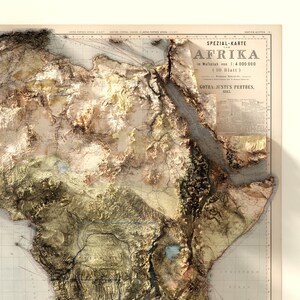 May include: A vintage map of Africa with a 3D relief effect, showing the continent's topography. The map is titled "Speziall-Karte von Afrika" and is dated 1885. The map is printed on paper and has a light brown color.