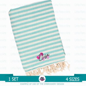 May include: A turquoise and white striped beach towel with a fringe border. The towel has the name "Elisa" embroidered on it in pink and black.