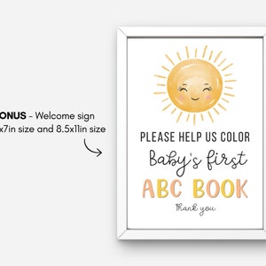 May include: A white sign with a yellow sun with a smiling face. The text on the sign reads "PLEASE HELP US COLOR Baby's first ABC BOOK Thank you".