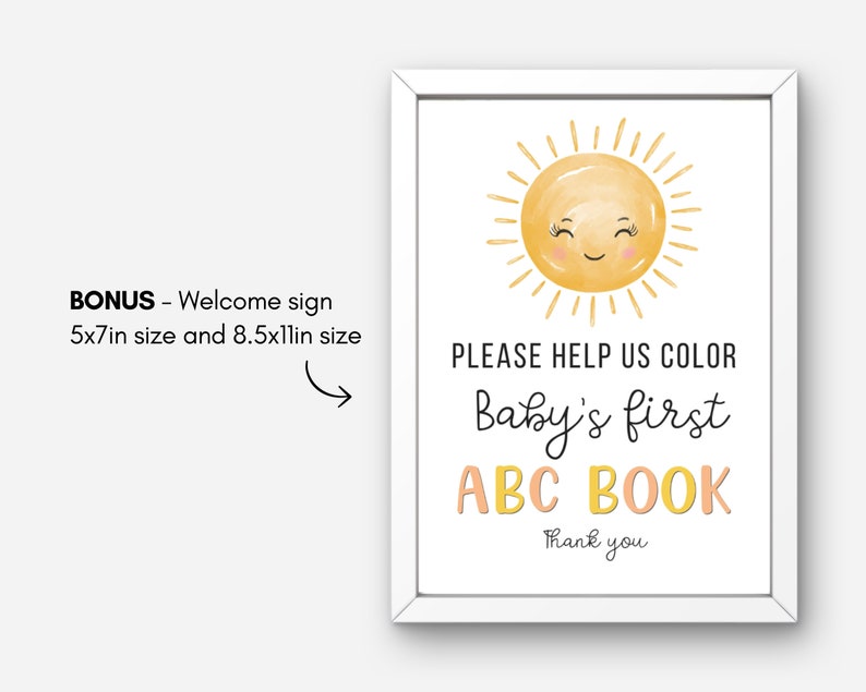 May include: A white sign with a yellow sun with a smiling face. The text on the sign reads "PLEASE HELP US COLOR Baby's first ABC BOOK Thank you".