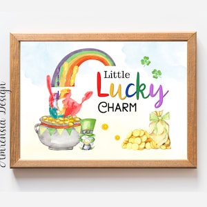 May include: A watercolor painting of a pot of gold with a rainbow, a leprechaun, and a bag of gold coins. The text "Little Lucky Charm" is written in colorful letters.
