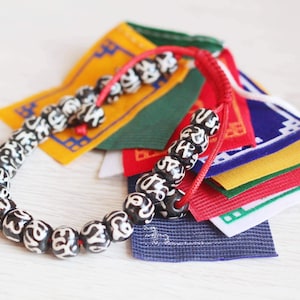Bone bracelets / 8mm mantra om / adjustable / Buddha yoga wrist mala / Handmade Nepal jewelry