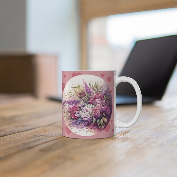 Mug 11oz for Mother's Day. Something she can use all year for her coffee or  tea or hot chocolate. Pink with a beautiful bouquet of flowers