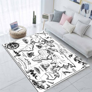 May include: Black and white vintage world map rug with a compass, a telescope, and nautical details. The rug features the text "Vintage World Map".