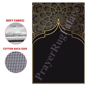 May include: A black prayer rug with a gold mandala design and a gold arch. The rug has a soft fabric top and a cotton back side.