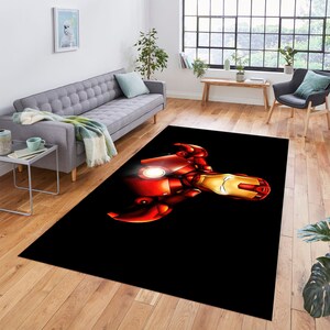 May include: A black and red area rug with a graphic of Iron Man's face and chest.