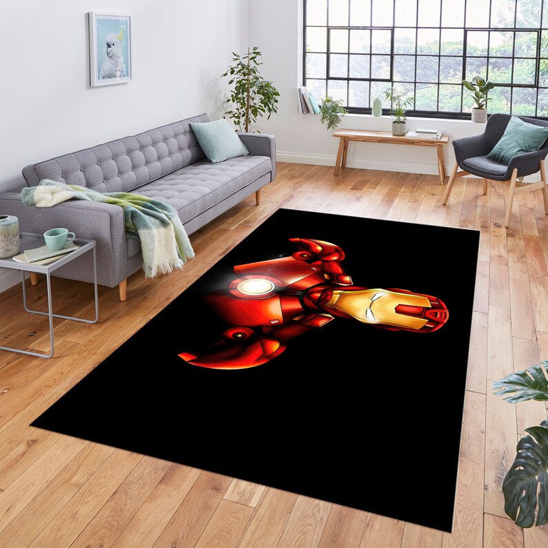 May include: A black and red area rug with a graphic of Iron Man's face and chest.