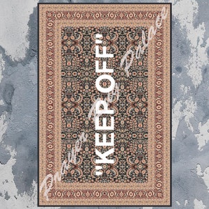 May include: A black and white rug with a floral pattern and a white border. The text "KEEP OFF" is printed in white in the centre of the rug.