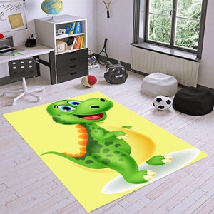 May include: A yellow rug featuring a cartoon green dinosaur with orange spikes on its back. The dinosaur is smiling and has large blue eyes. The dinosaur is standing on a white cloud.