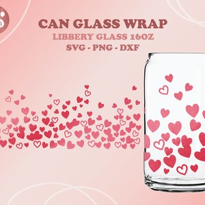 May include: A clear Libbey glass can wrap with a design of red hearts. The words "CAN GLASS WRAP" and "LIBBERY GLASS 16OZ" are printed on the image. The background is a gradient of pink.