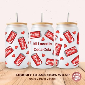 May include: A set of three 16oz Libbey glass tumblers with bamboo lids and straws. The glasses are decorated with red Coca-Cola cans and hearts on a white background. One glass has the text "All I need is Coca Cola".