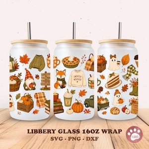 May include: Three frosted glass tumblers with bamboo lids and metal straws, featuring a repeating autumn-themed pattern of pumpkins, ghosts, foxes, sweaters, pies, and fall foliage. The text "LIBBERY GLASS 16OZ WRAP SVG - PNG - DXF" is printed below.