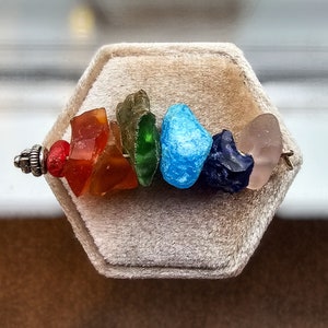 Hand made stunning rainbow sea tumbled glass chakra charm pendant.