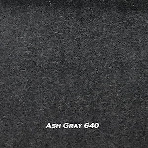 May include: A close-up of a textured, dark gray fabric. The fabric has a slightly rough appearance with visible fibers. The text "ASH GRAY 640" is displayed in white at the bottom of the image.